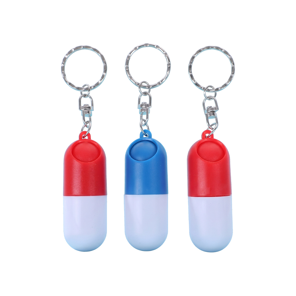 Capsulevormig pillendoosje met sleutelhanger